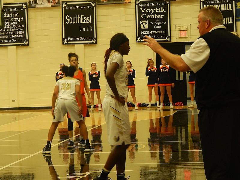 Bradley Central's Rhyne Howard, center, scored 27 points and grabbed 15 rebounds in the Bearettes' 63-34 state-sectional basketball win over Blackman. Bradley is one of eight Class AAA teams that will play in the state tournament, which starts on Wednesday.