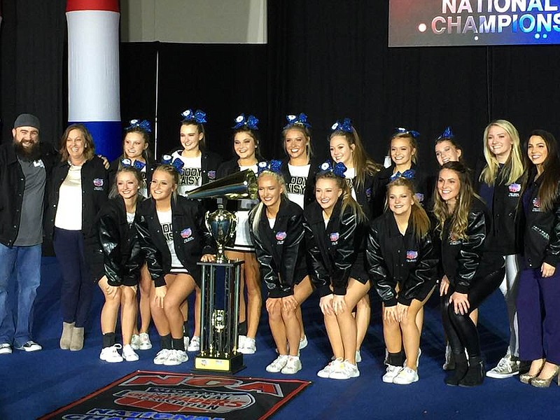 Soddy-Daisy High School's competitive cheerleading squad poses with coaches following their big win. (Contributed photo)