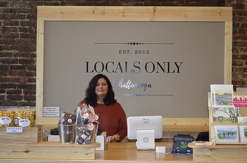 Locals Only owner Danielle Landrum stands in the business's new location on Market Street across from the Chattanooga Choo-Choo. (Staff photo by Emily Crisman)
