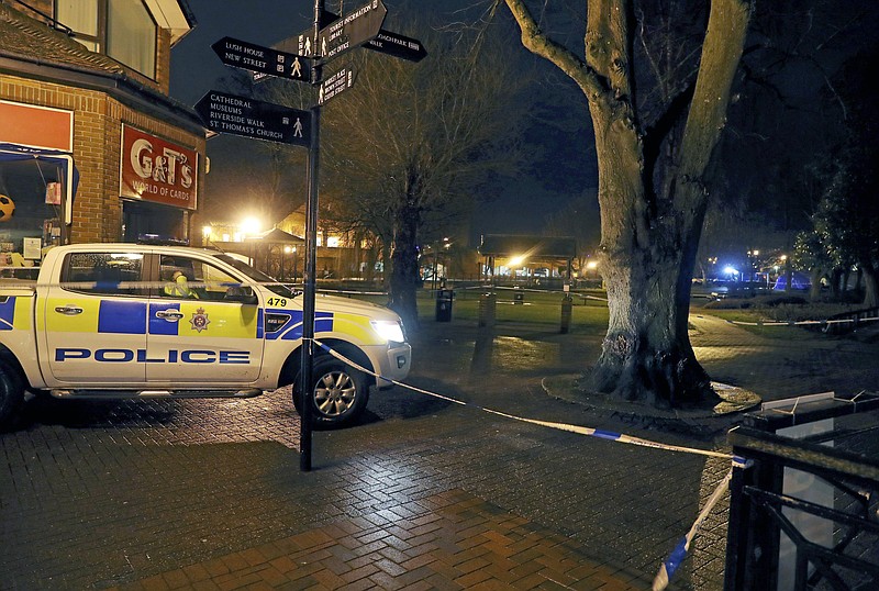 Police cordon off the area near the Maltings in Salisbury, England, where British media reported Monday, March 5, 2018 that a former Russian spy was in critical condition after coming into contact with an "unknown substance" on Sunday. British media identified him as Sergei Skripal, 66, who was convicted in Russia on charges of spying for Britain and sentenced in 2006 to 13 years in prison. Skripal was freed in 2010 as part of a U.S.-Russian spy swap. (Steve Parsons/PA via AP)