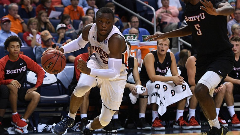 Auburn sophomore guard Mustapha Heron drives to the basket during an exhibition loss to Division II Barry University on Nov. 2.