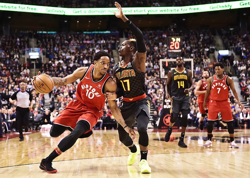 Toronto Raptors guard DeMar DeRozan (10) drives against Atlanta Hawks guard Dennis Schroeder (17) during the second half of an NBA basketball game Tuesday, March 6, 2018, in Toronto. (Frank Gunn/The Canadian Press via AP)