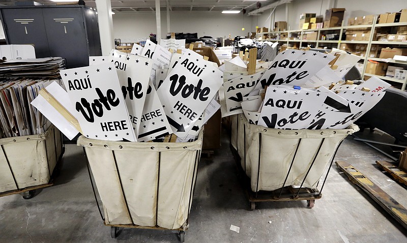 In this Feb. 13, 2018, file photo, bins of signs are seen in a storage are at the Bexar County Election offices in San Antonio. Texas kicks off primary season this ahead of the 2018 midterm election, with implications for Democrats and Republicans alike in an election year that could alter the direction of Congress and statehouses around the country for the final two years of President Donald Trump's current term. (AP Photo/Eric Gay, File)