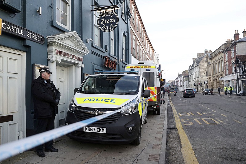 
              A policeman stands outside the Zizzi restaurant in Salisbury, England Wednesday, March 7, 2018 near to where former Russian double agent Sergei Skripal was found critically ill. Britain's counterterrorism police took over an investigation Tuesday into the mysterious collapse of a former spy and his daughter, now fighting for their lives. The government pledged a "robust" response if suspicions of Russian state involvement are proven. Sergei Skripal and his daughter are in a critical condition after collapsing in the English city of Salisbury on Sunday. (Andrew Matthews/PA via AP)
            