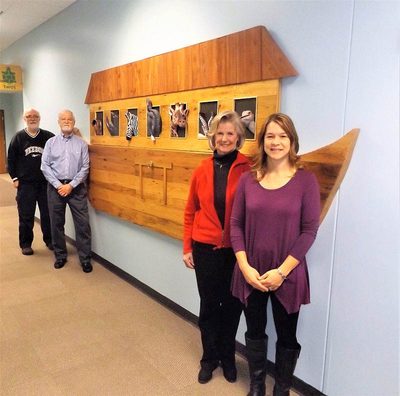 From left, Milton Nelson, Tom Brock, Sandra Corum and Amy Vetter created this two-dimensional Noah's Ark wall decoration for a hallway at First Broad Street United Methodist Church in Kingsport, Tennessee. The detailed, handmade piece features reclaimed barn wood.