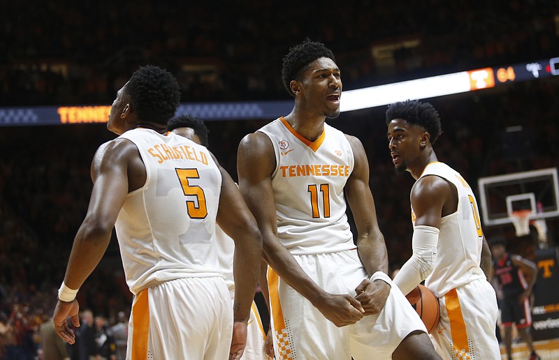 Tennessee forward Kyle Alexander (11) and forward Admiral Schofield (5) celebrate in the final seconds of the second half of an NCAA college basketball game against Georgia on Saturday, March 3, 2018, in Knoxville, Tenn. (AP Photo/Crystal LoGiudice)