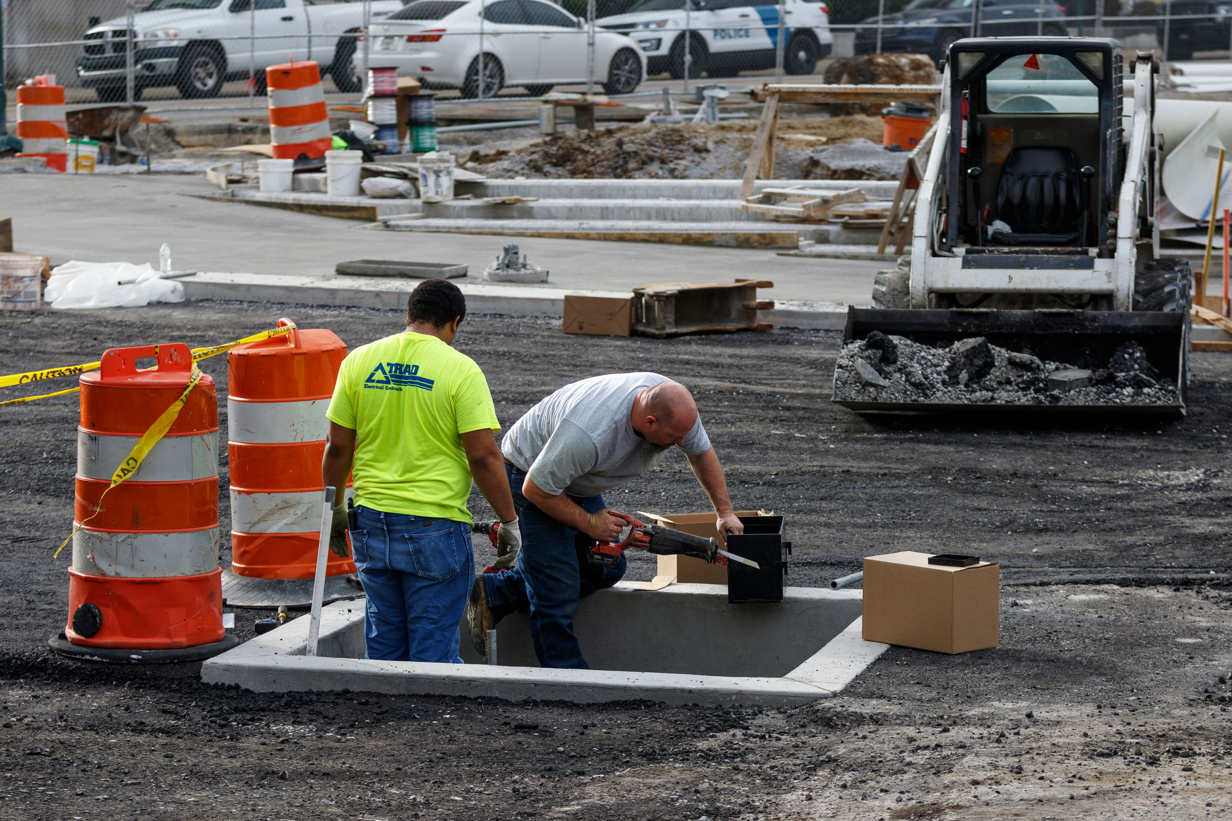 Construction crews work in the middle of Martin Luther King Boulevard at Miller Park on Thursday, Feb. 22, 2018, in Chattanooga, Tenn. Martin Luther King Boulevard will remain closed at its intersection with the park until March 13 after the discovery of an unexpectedly high water main delayed the road's resurfacing by about three weeks, according to Chattanooga Department of Public Works administrator Justin Holland.