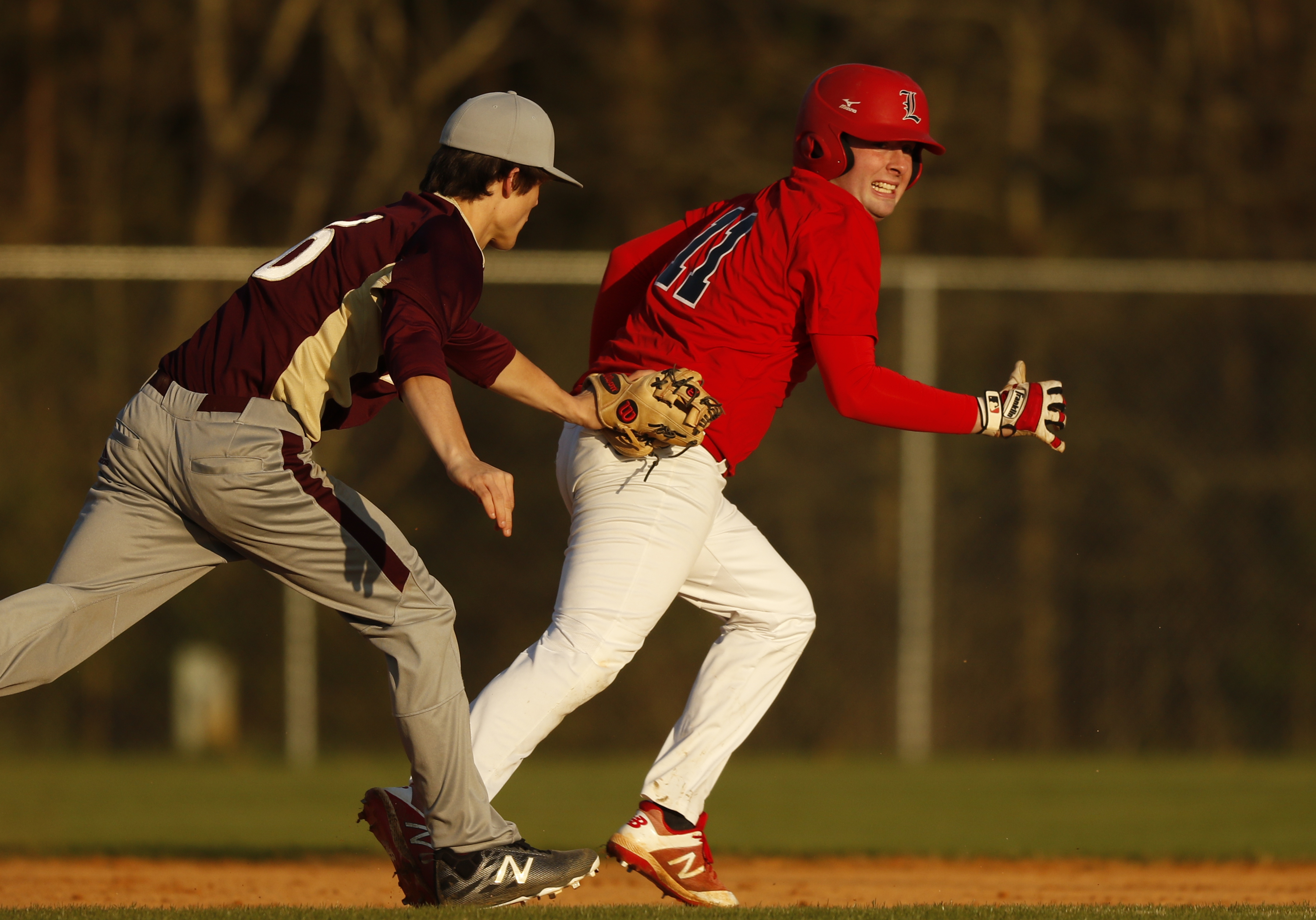 Dade County shortstop Seth Swader runs down LFO runner Matthew Trusley in the base path after he tried to sneak an extra base out of a walk during their prep baseball game at Dade County High School on Thursday, March 8, 2018, in Trenton, Ga.