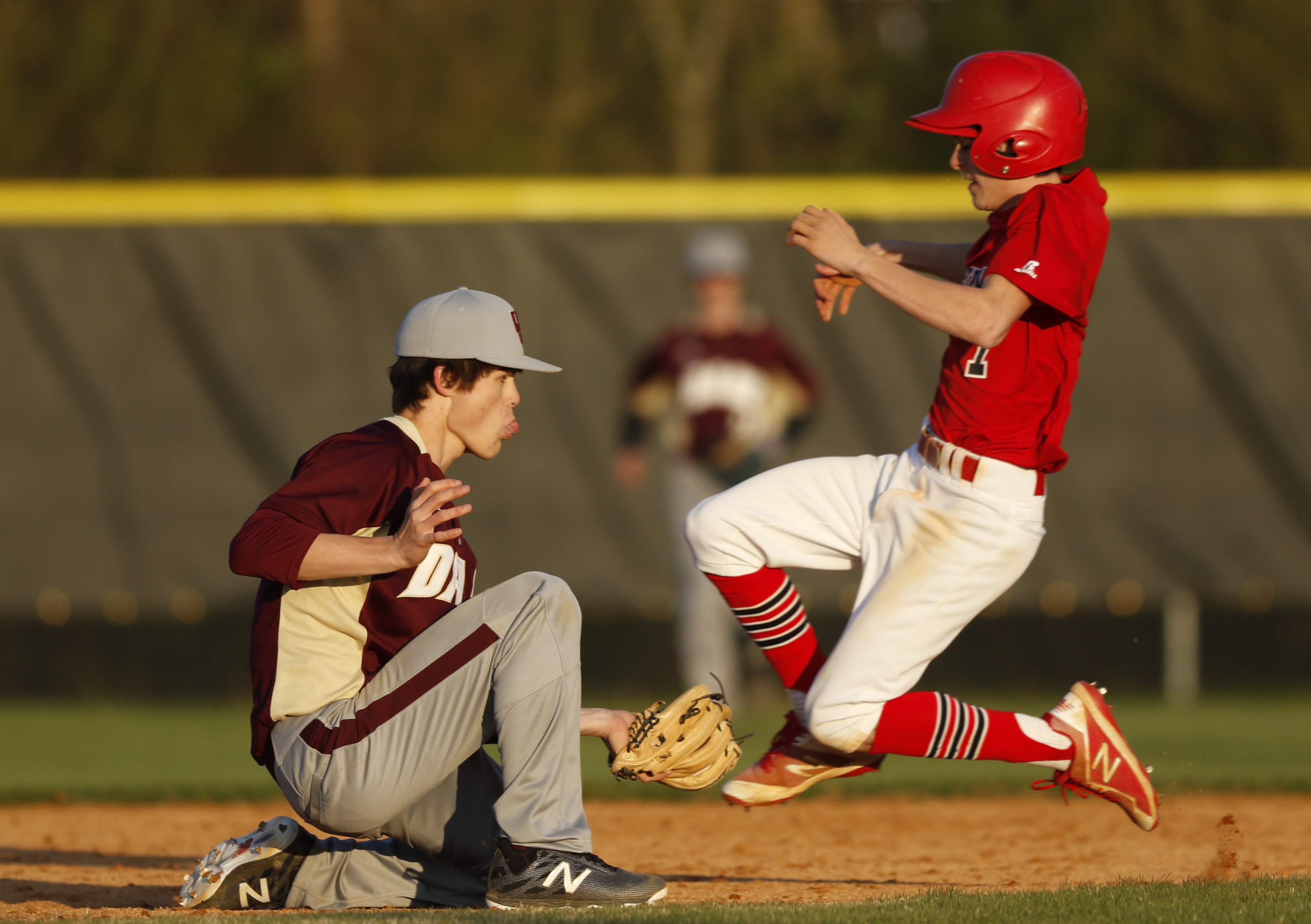 LFO runner Nelson Chapman slips past a tag by Dade County shortstop Seth Swader their prep baseball game at Dade County High School on Thursday, March 8, 2018, in Trenton, Ga.