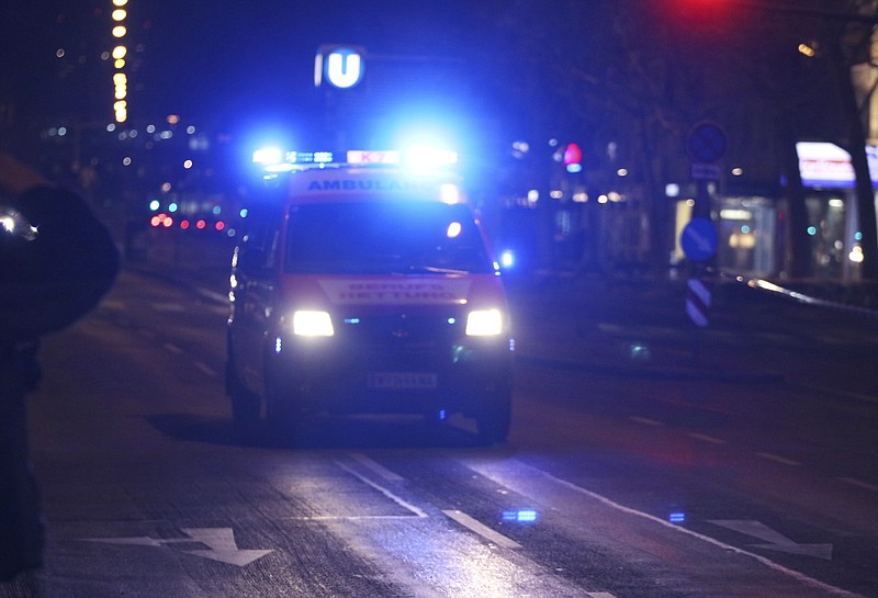 
              An ambulance drives on the street after several people have been injured in a knife attack on the streets of Vienna, Austria, Wednesday, March 7, 2018. (AP Photo/Ronald Zak)
            