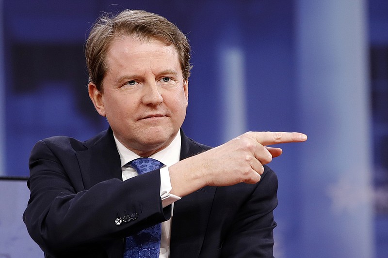 In this Feb. 22, 2018, file photo, White House counsel Don McGahn gestures while speaking at the Conservative Political Action Conference (CPAC), at National Harbor, Md. As a candidate, Donald Trump pledged to drain the swamp in Washington. But as president, records show he and his appointees have stocked federal agencies with ex-lobbyists and corporate lawyers who now help regulate they very industries rom which they collected paychecks. Records reviewed by The Associated Press show McGahn, has issued at least 24 ethics waivers to key administration officials at the White House and executive branch agencies. (AP Photo/Jacquelyn Martin, File)