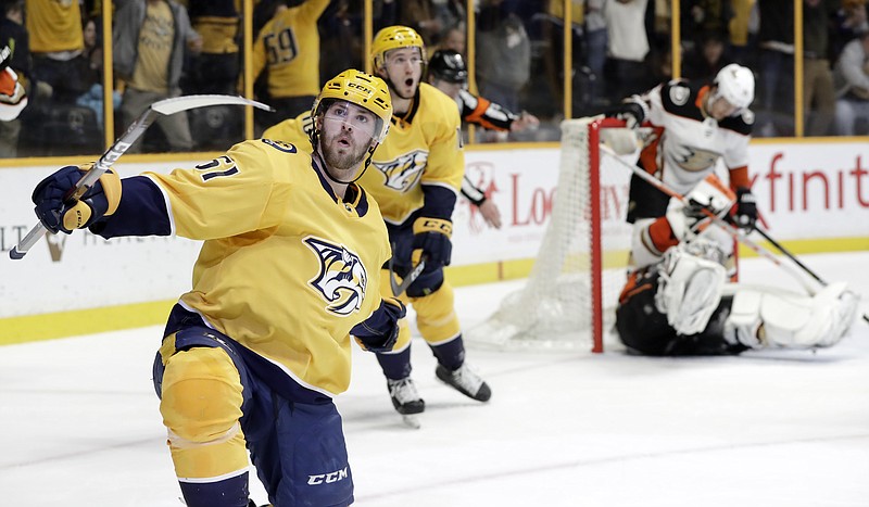 Nashville Predators left wing Austin Watson (51) celebrates after scoring a goal against Anaheim Ducks goalie John Gibson, right, in the second period of an NHL hockey game Thursday, March 8, 2018, in Nashville, Tenn. (AP Photo/Mark Humphrey)