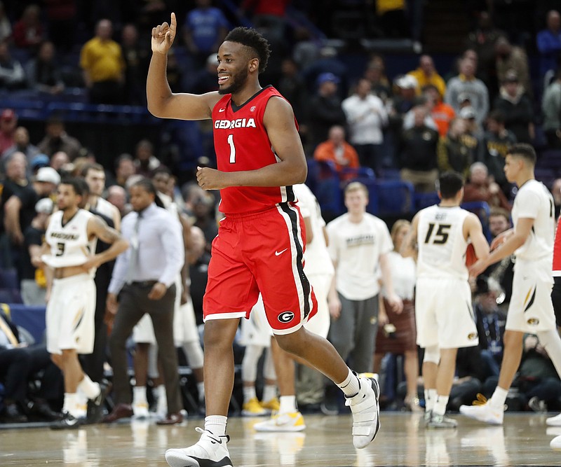Georgia's Yante Maten celebrates as he runs off the court after the Bulldogs beat Missouri 62-60 in the second round of the SEC men's basketball tournament Thursday in St. Louis. Maten had 21 points and 10 rebounds in the victory.