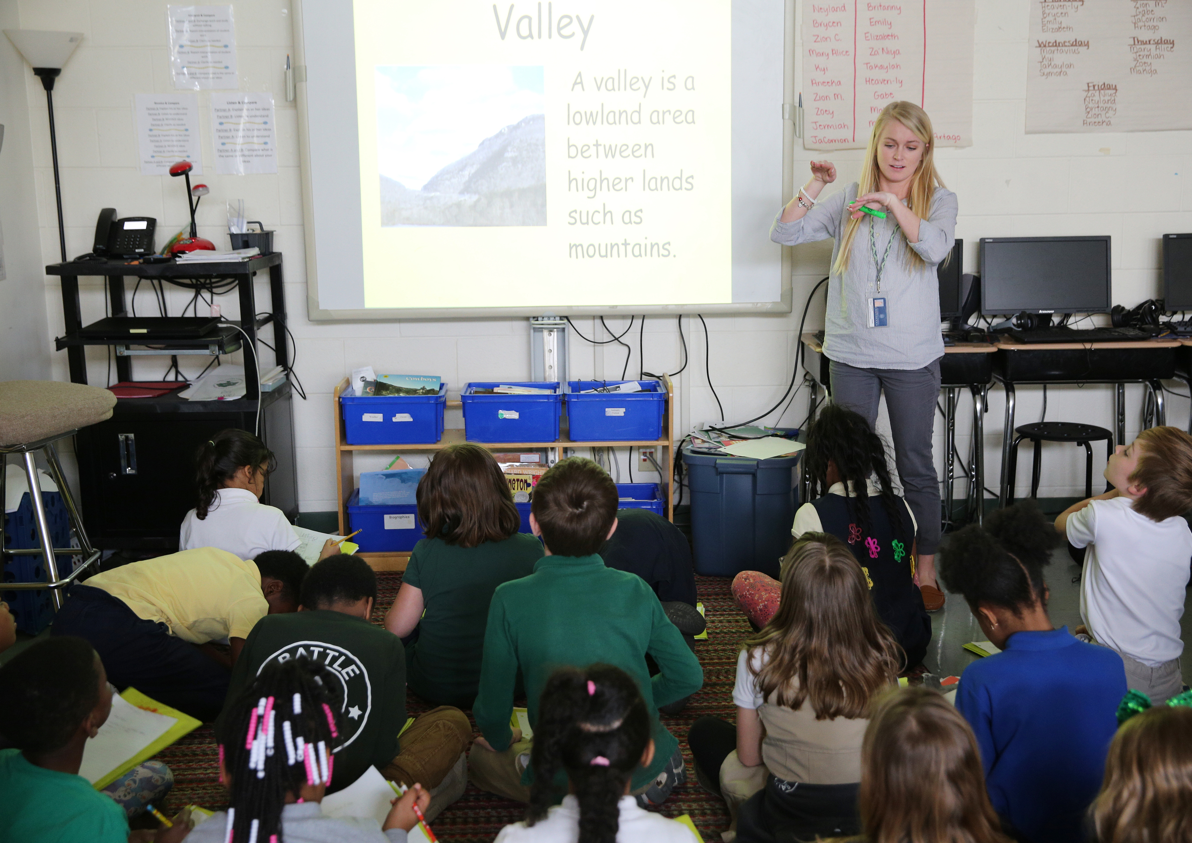 Christin Willingham, a senior in the University of Tennessee at Chattanooga's School of Education, teaches a group of students in Wendy Scruggs' class at Battle Academy about different landforms Wednesday, March 7, 2018 in Chattanooga, Tenn. The new model for UTC's residency program is shifting to a year-long model, which many teacher prep programs across the state already do.