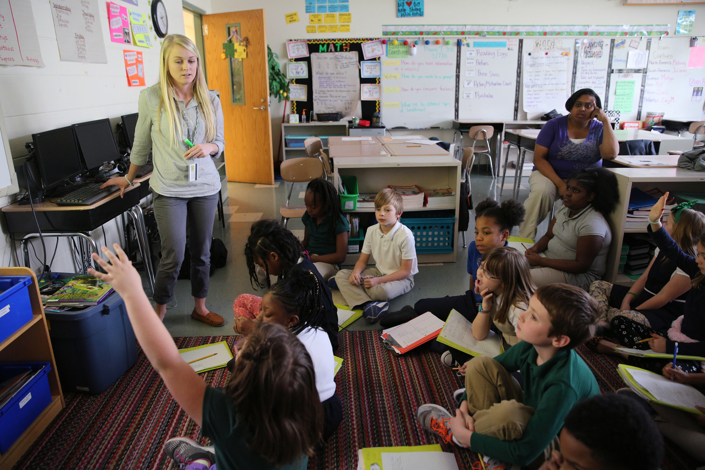 Christin Willingham, a senior in the University of Tennessee at Chattanooga's School of Education, teaches a group of students in Wendy Scruggs' class as Scruggs monitors at Battle Academy about different landforms Wednesday, March 7, 2018 in Chattanooga, Tenn. The new model for UTC's residency program is shifting to a year-long model, which many teacher prep programs across the state already do.