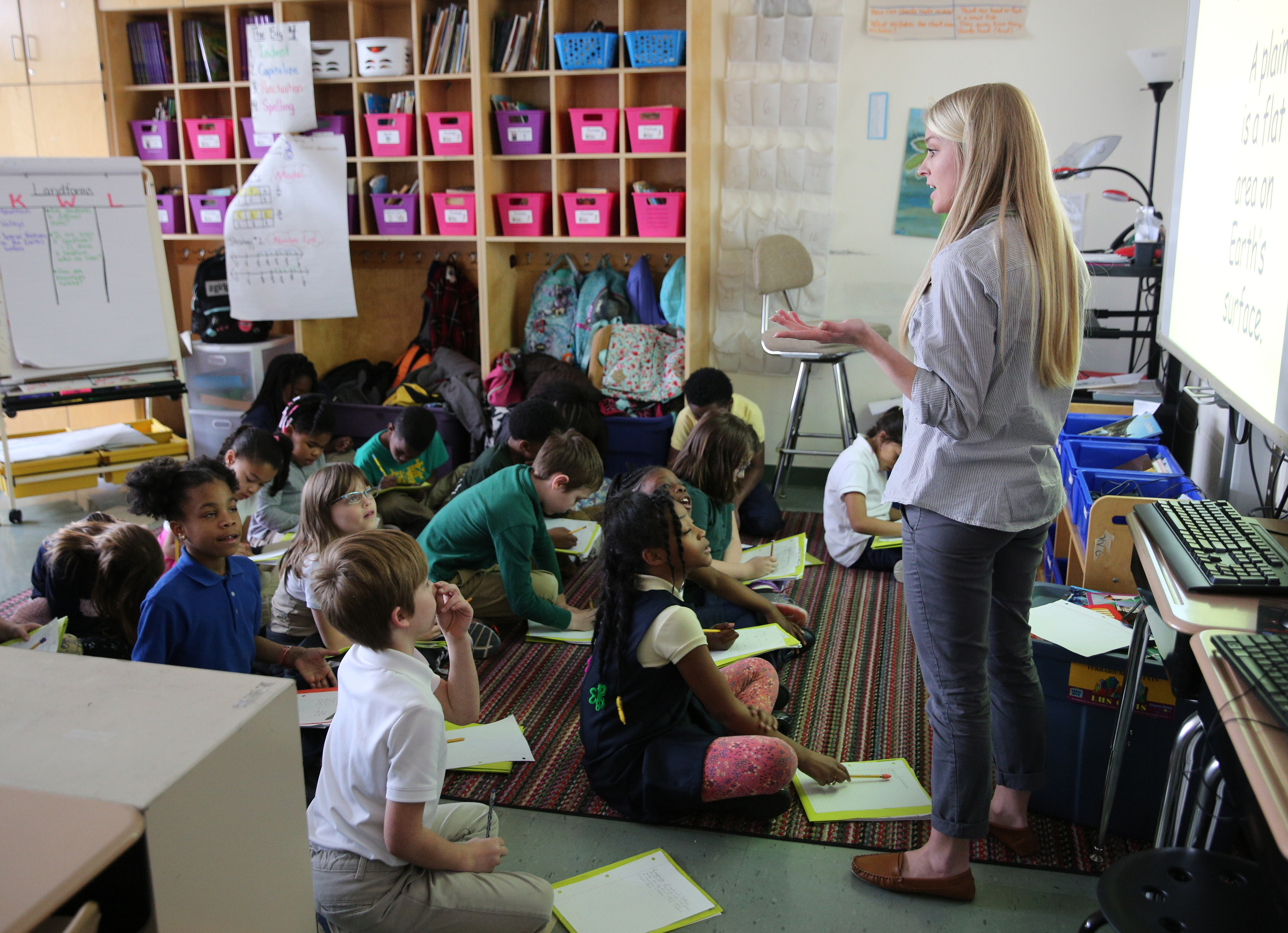 Christin Willingham, a senior in the University of Tennessee at Chattanooga's School of Education, teaches a group of students in Wendy Scruggs' class at Battle Academy about different landforms Wednesday, March 7, 2018 in Chattanooga, Tenn. The new model for UTC's residency program is shifting to a year-long model, which many teacher prep programs across the state already do.