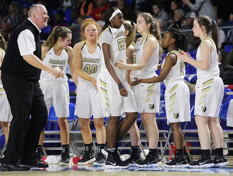 Staff photo by Erin O. Smith / Bradley Central head coach Jason Reuter looks up at the scoreboard as Bradley Central's Rhyne Howard (23) walks off the court for the final time of her career after being called for her fifth foul with 40.6 seconds left in the fourth quarter of the Bradley Central vs. Houston girls' Class AAA state basketball tournament semifinal game Friday, March 9, 2018 in Murphy Center at Middle Tennessee State University in Murfreesboro, Tenn. Bradley Central fell to Houston 52-49.