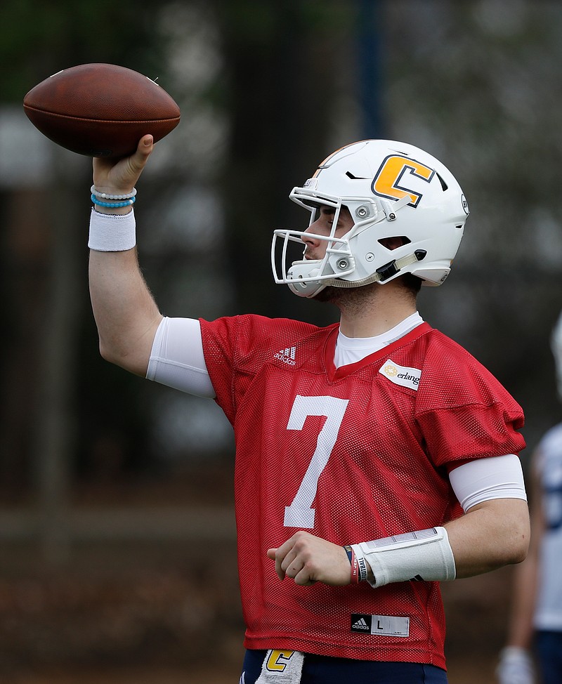 Quarterback Nick Tiano tosses the ball to a coach during the UTC football team's first spring practice at Scrappy Moore Field on Saturday, Feb. 24, 2018, in Chattanooga, Tenn. 