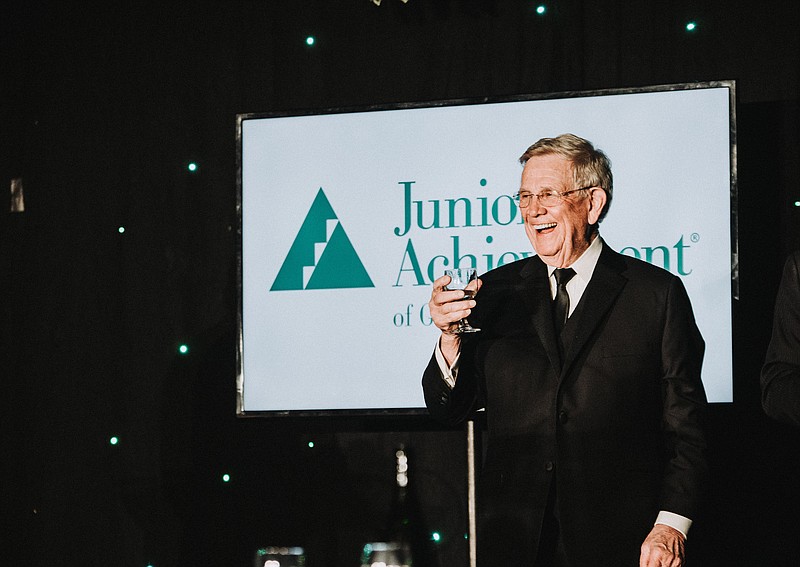 Contributed photo Catherine Cansler Photography / Bob Shaw drinks a toast as he was named to the Junior Achievement of Northwest Georgia Business Hall of Fame.