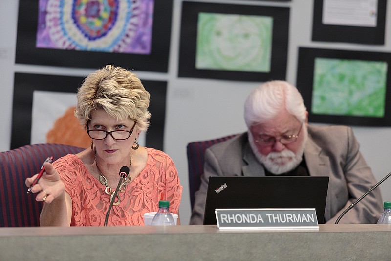 In this Thursday, July 20, 2017, staff file photo, school board members Rhonda Thurman, left, and David Testerman discuss a school Partnership Zone proposal during a Hamilton County Board of Education meeting in Chattanooga.