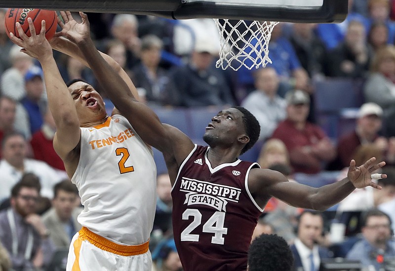 
SEC Mississippi St Tennessee Basketball
Tennessee's Grant Williams (2) and Mississippi State's Abdul Ado (24) reach for a rebound during the first half of an NCAA college basketball game in the quarterfinals of the Southeastern Conference men's tournament Friday, March 9, 2018, in St. Louis. (AP Photo/Jeff Roberson)