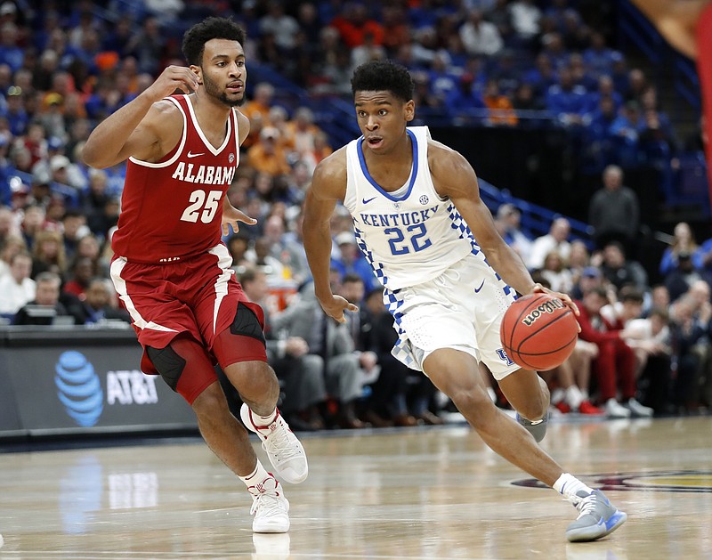 Kentucky's Shai Gilgeous-Alexander (22) brings the ball down the court past Alabama's Braxton Key (25) during the second half of an NCAA college basketball semifinal game at the Southeastern Conference tournament Saturday, March 10, 2018, in St. Louis. Kentucky won 86-63. (AP Photo/Jeff Roberson)