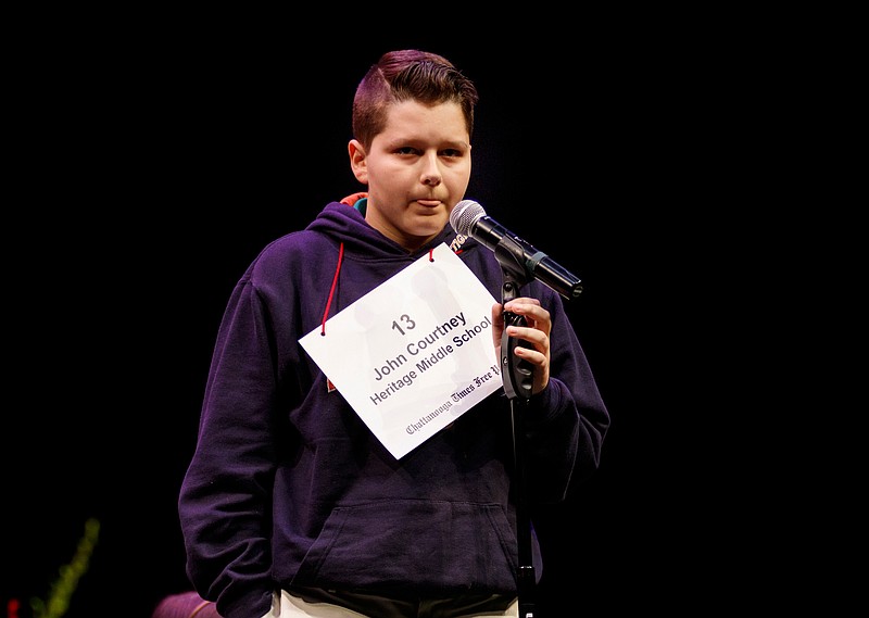 Heritage Middle School student John Courtney spells a word during the 2018 Times Free Press Regional Spelling Bee at the Roland Hayes Auditorium on the campus of the University of Tennessee at Chattanooga on Saturday, March 10, 2018, in Chattanooga, Tenn. Courtney went on to win the bee by correctly spelling the word "Stalactite." 