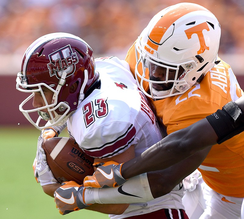 Tennessee's Micah Abernathy (22) tackles UMass's Andy Isabella (23).  The University of Massachusetts Minutemen visited the University of Tennessee Volunteers in NCAA football action in Knoxville on September 23, 2017. 