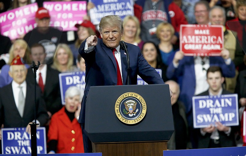President Donald Trump reacts to the crowd while speaking at a campaign rally for Republican Rick Saccone in a hangar, Saturday, March 10, 2018, in Moon Township, Pa. Saccone is running against Democrat Conor Lamb in a special election being held on March 13 for the Pennsylvania 18th Congressional District vacated by Republican Tim Murphy. (AP Photo/Keith Srakocic)