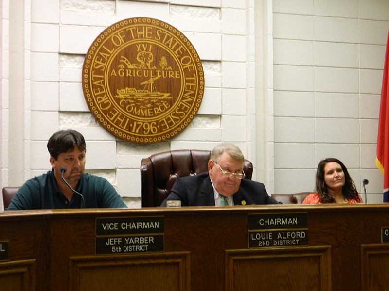 In this 2015 staff file photo, Bradley County Commission Vice Chairman Jeff Yarber, left, Commission Chairman Louie Alford and Commissioner Charlotte Peak listen to discussions concerning animal pickup proposals.