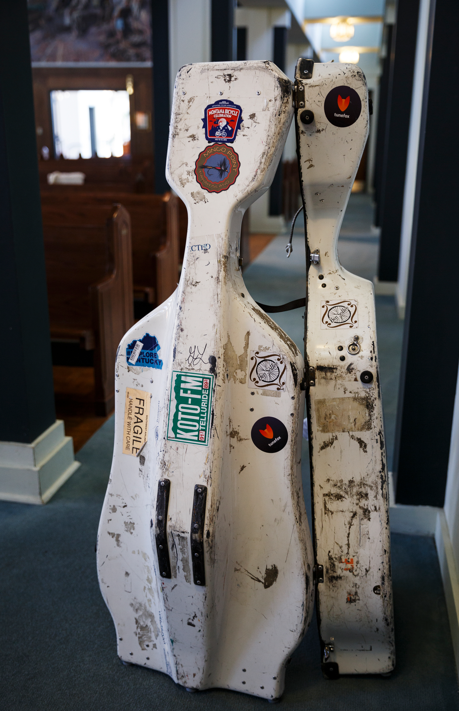 Cellist Ben Sollee's cello case is seen as he talks with students about music at St. Peter's Episcopal School on Tuesday, March 13, 2018, in Chattanooga, Tenn. Sollee, a musician known for touring by bicycle, offered students an introduction to the musical sounds of the cello while also talking about his journey to find his own musical voice.