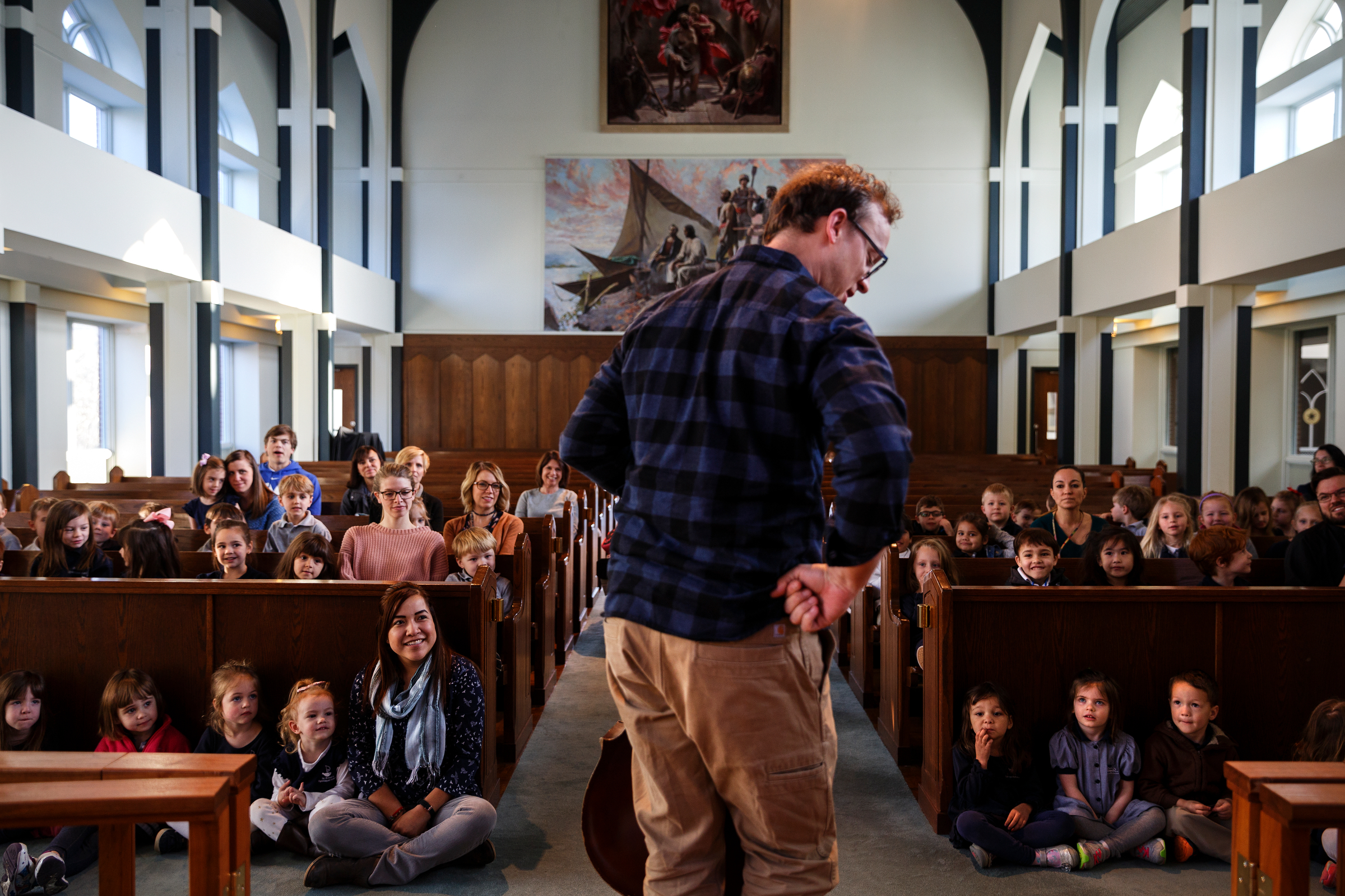 Cellist Ben Sollee talks about music for students during a workshop at St. Peter's Episcopal School on Tuesday, March 13, 2018, in Chattanooga, Tenn. Sollee, a musician known for touring by bicycle, offered students an introduction to the musical sounds of the cello while also talking about his journey to find his own musical voice.