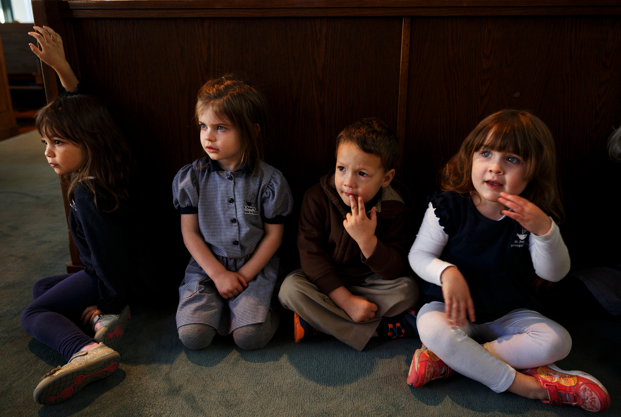 Nina McClain, Emaline Thompson, Cluz Armstrong, and Hadley Scot, from left, listen as cellist Ben Sollee performs for students during a workshop at St. Peter's Episcopal School on Tuesday, March 13, 2018, in Chattanooga, Tenn. Sollee, a musician known for touring by bicycle, offered students an introduction to the musical sounds of the cello while also talking about his journey to find his own musical voice.