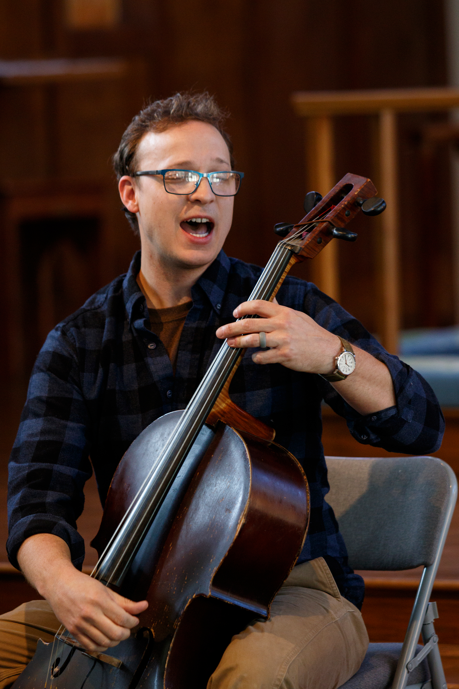 Cellist Ben Sollee performs for students during a workshop at St. Peter's Episcopal School on Tuesday, March 13, 2018, in Chattanooga, Tenn. Sollee, a musician known for touring by bicycle, offered students an introduction to the musical sounds of the cello while also talking about his journey to find his own musical voice.