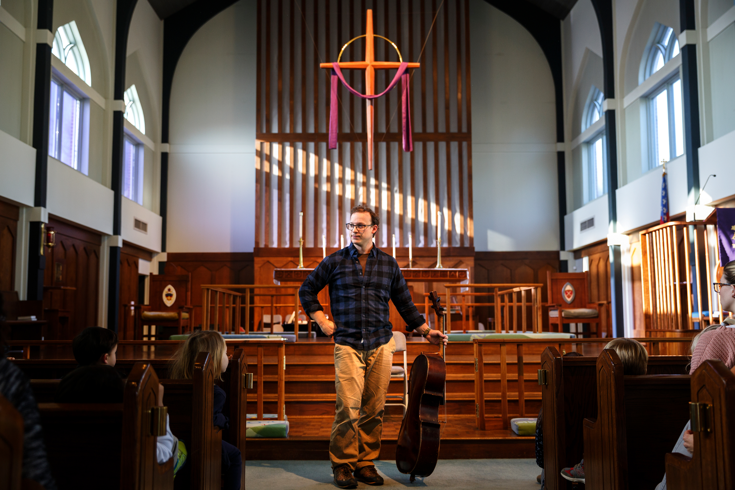 Cellist Ben Sollee talks about music with students during a workshop at St. Peter's Episcopal School on Tuesday, March 13, 2018, in Chattanooga, Tenn. Sollee, a musician known for touring by bicycle, offered students an introduction to the musical sounds of the cello while also talking about his journey to find his own musical voice.