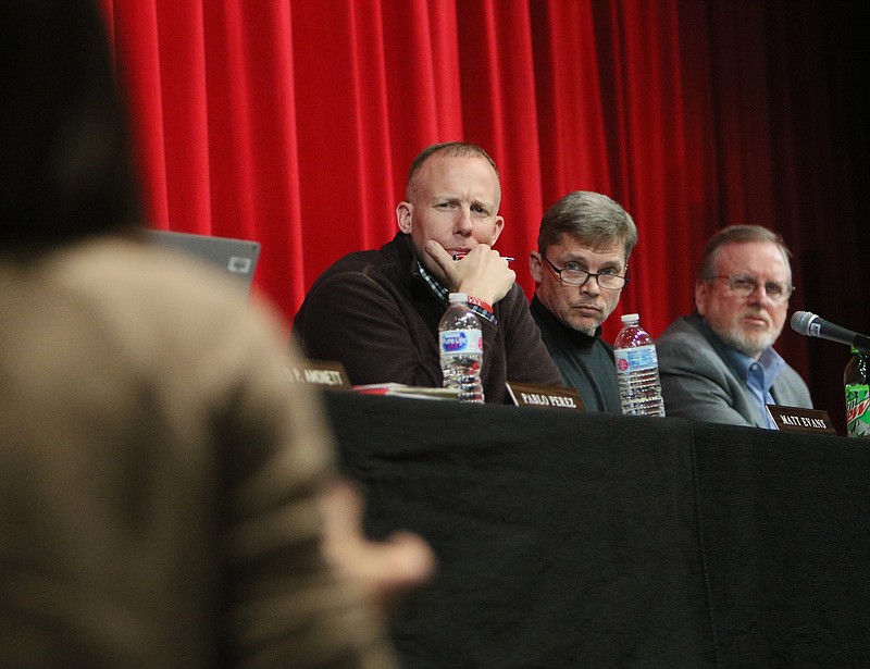 Board of education members Matt Evans, Richard Fromm and Palmer Griffin listen to parents and other community members voice their questions Tuesday, March 13, 2018 at Dalton High School in Dalton, Ga. The Dalton Board of Education hosted a public forum on school safety to present ideas to the community as well as to provide members of the community the opportunity to speak.