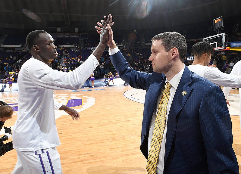 LSU first-year basketball coach Will Wade and Tigers senior forward Duop Reath will continue their season tonight in the NIT.