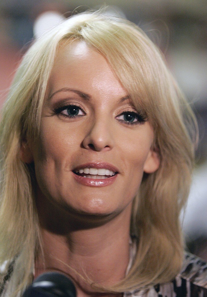 In this May 6, 2009 file photo, Stormy Daniels visits a local restaurant in downtown New Orleans. The adult film actress who said she had sex with President Donald Trump is offering to return the $130,000 she was paid for agreeing not to discuss their alleged relationship. An attorney for Stormy Daniels, whose real name is Stephanie Clifford, sent a letter to Trump's lawyer Monday, March 12, 2018, saying she would wire the money to Trump if she could speak openly about their relationship. (AP Photo/Bill Haber, File)