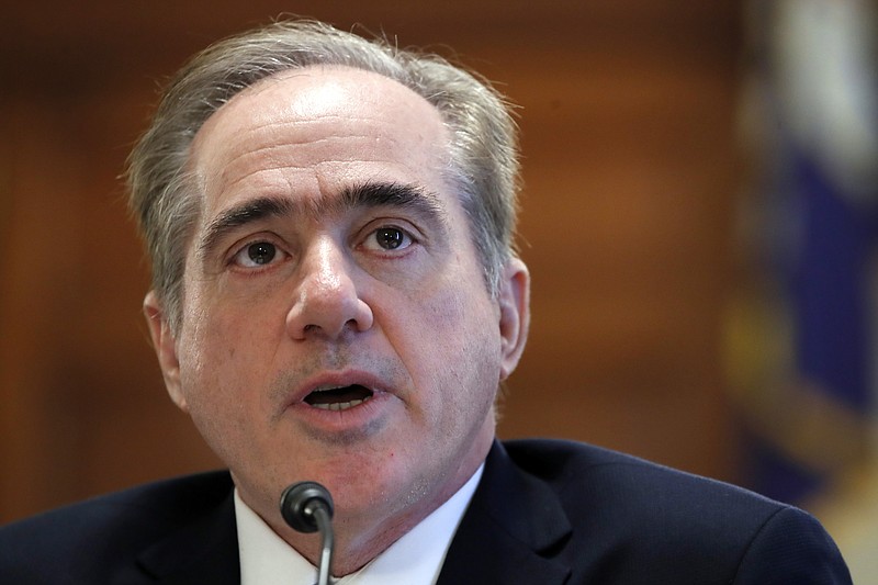 In this Feb. 6, 2018, file photo, Veterans Affairs Secretary David Shulkin speaks during a House Committee on Veterans' Affairs hearing on veteran caregiver support on Capitol Hill in Washington. Shulkin is hanging onto his job by a thread. He faces an insurgency from within his department and new allegations that he had a member of his security detail go shopping with him at Home Depot and then cart the purchases into his house. (AP Photo/Jacquelyn Martin, File)