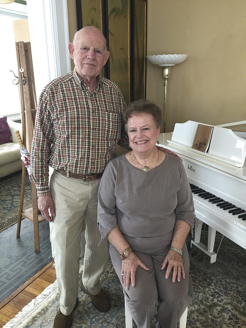 Hurricane Katrina survivors Gerald and Genendal Fratantuono pose by a piano salvaged from their flooded home near Gulfport, Miss. The couple are moving from their current home in Brainerd back to coastal Mississippi.