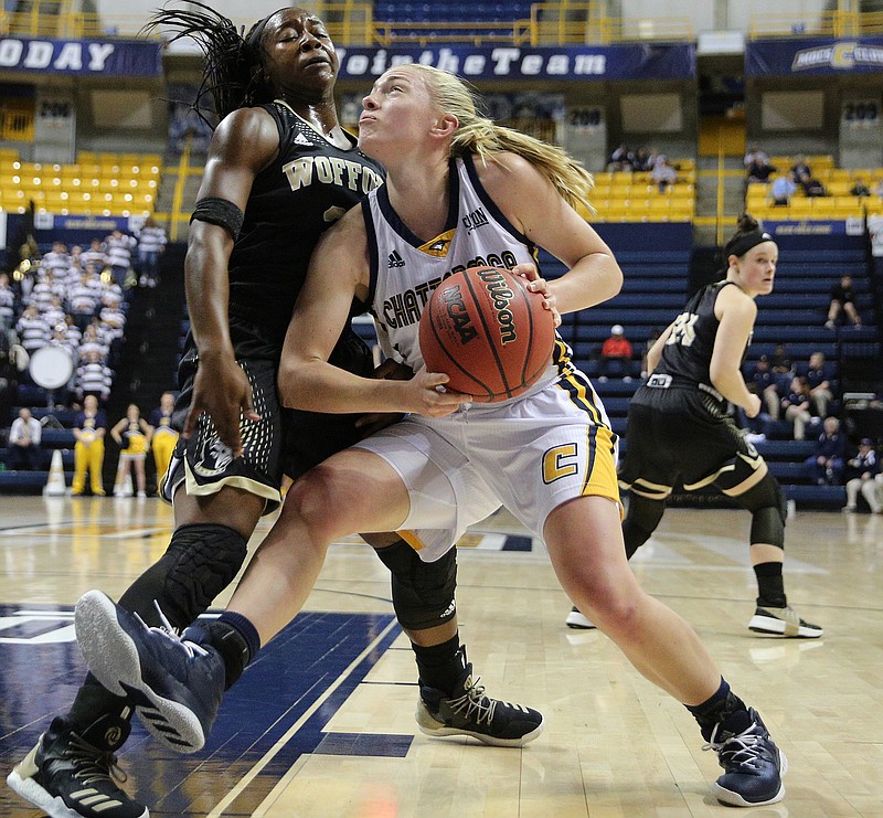 Wofford's Da'Ja Green (35) guards University of Tennessee at Chattanooga's Lakelyn Bouldin (33) as she goes up for a shot Saturday, Feb. 17, 2018 during the UTC vs. Wofford women's basketball game at McKenzie Arena in Chattanooga, Tenn. 