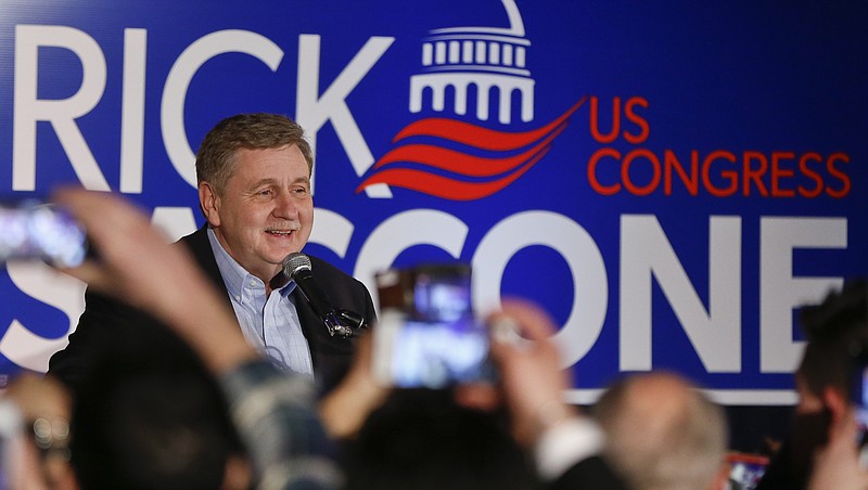 Republican Rick Saccone thanks supporters at the party watching the returns for a special election being held for the Pennsylvania 18th Congressional District vacated by Republican Tim Murphy, Tuesday, March 13, 2018, in McKeesport, Pa. A razor's edge separated Democrat Conor Lamb and Saccone Tuesday night in their closely watched special election in Pennsylvania, where a surprisingly strong bid by first-time candidate Lamb was testing Donald Trump's sway in a GOP stronghold. (AP Photo/Keith Srakocic)