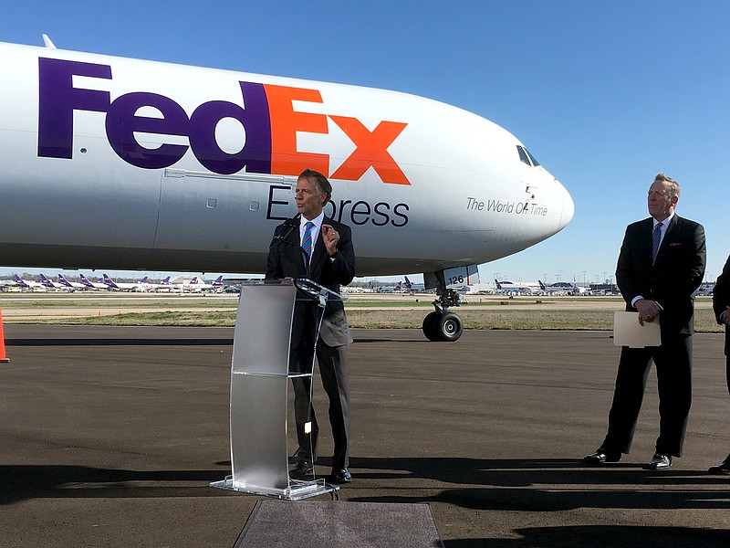 Tennessee Gov. Bill Haslam, left, talks to reporters about a newly announced $1 billion investment by FedEx Corp. at its hub in Memphis, Tenn., on Wednesday, March 14, 2018. 