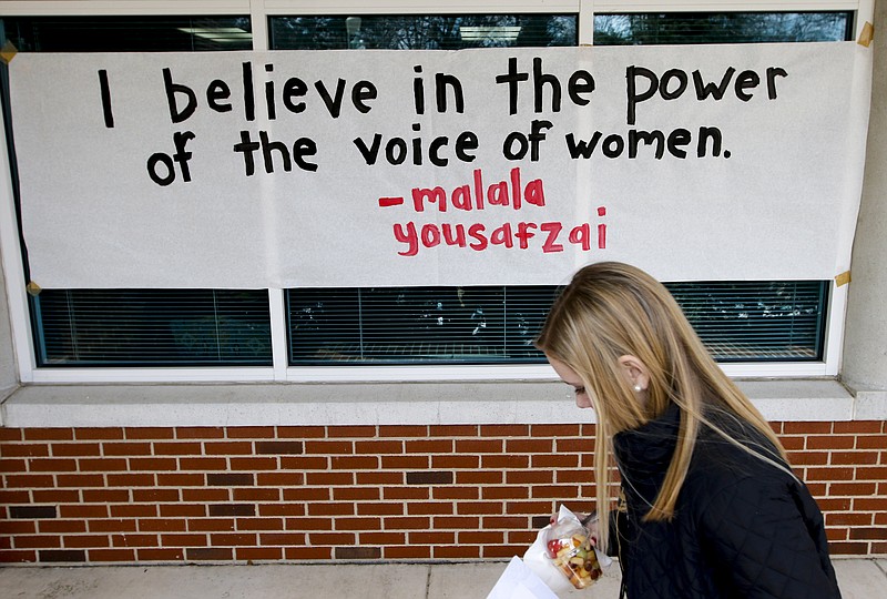 A woman walks past a quote by Nobel Peace Prize winner Malala Yousafzai at the "Mad, Bad, and Dangerous" event at Girls' Preparatory School in 2015. Now referred to as "Mighty, Brilliant and Determined," the 2018 event will be held this Saturday from 1 to 7 p.m. at GPS. The event is free and open to the public.