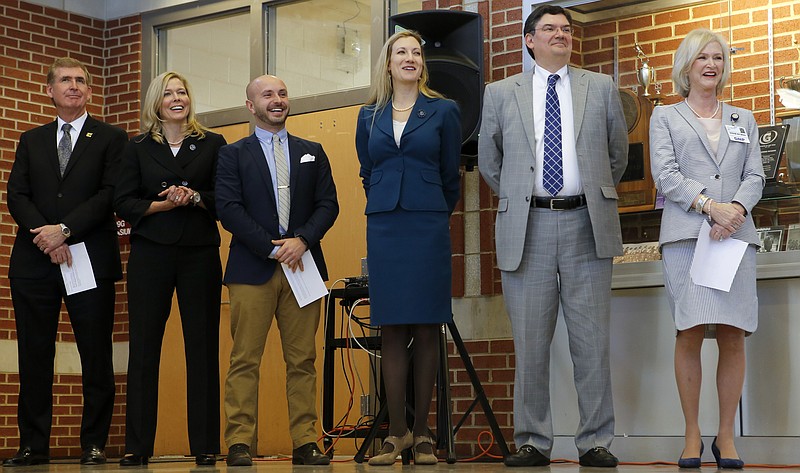 University of Tennessee at Chattanooga Chancellor Steven Angle, left, Chattanooga State Community College President Rebecca Ashford, Unum Community Relations Specialist Miles Huff, Chattanooga Area Chamber President and CEO Christy Gillenwater, JPMorgan Chase & Co. Market Executive Hamp Johnston and Erlanger Senior Vice President and Chief Nursing Executive Jan Keys laugh as Superintendent Bryan Johnson (not pictured) speaks during a press conference announcing the launch of the Future Ready Institutes at Howard School on Thursday, March 15, 2018 in Chattanooga, Tenn. The 11 Hamilton County schools to have a Future Ready Institute are: Brainerd High, East Hamilton Middle/High, East Ridge High, Hixson High, Howard High, Ooltewah High, Red Bank High, Sequoyah High, Tyner High, Signal Mountain Middle/High and Soddy-Daisy High.