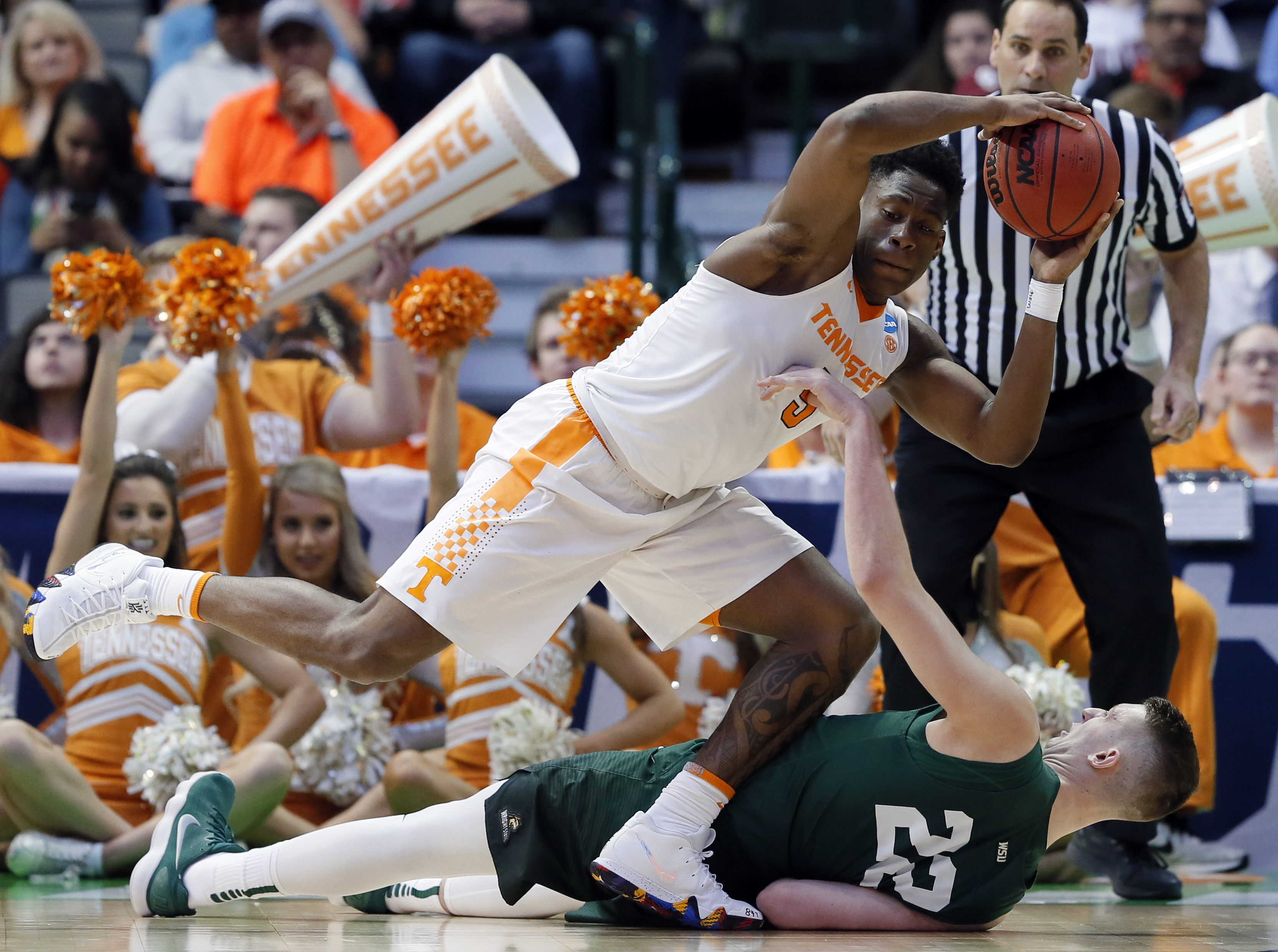 Tennessee forward Admiral Schofield grabs a loose ball over Wright State's Parker Ernsthausen during the second half of Thursday's game in Dallas. Schofield had 15 points and 12 rebounds to help the Vols secure a second-round matchup with Loyola of Chicago.