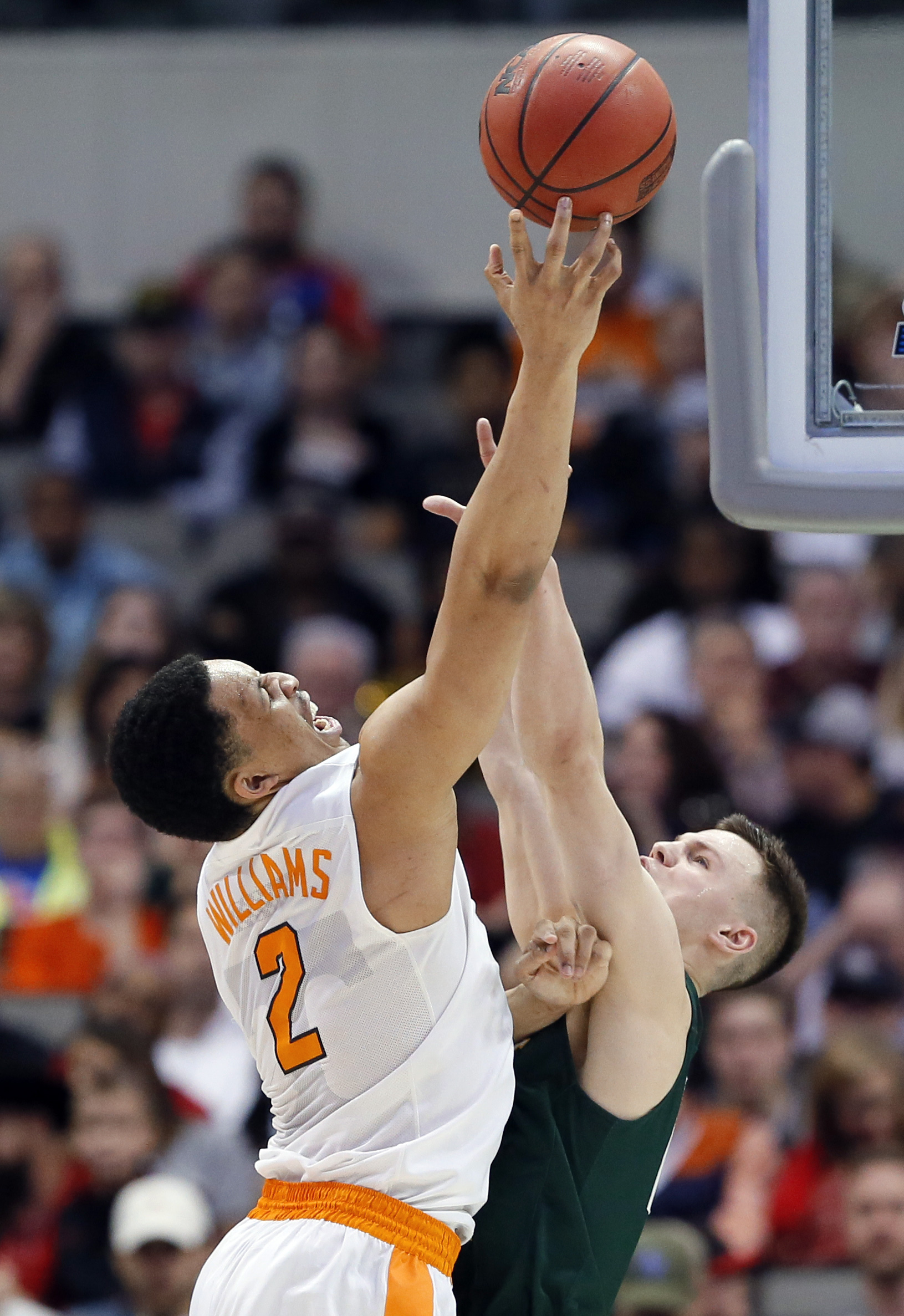 Tennessee forward Grant Williams (2) is fouled while taking a shot, by Wright State guard Grant Benzinger (13), in the second half of a first-round game at the NCAA college basketball tournament in Dallas, Thursday, March 15, 2018. (AP Photo/Tony Gutierrez)