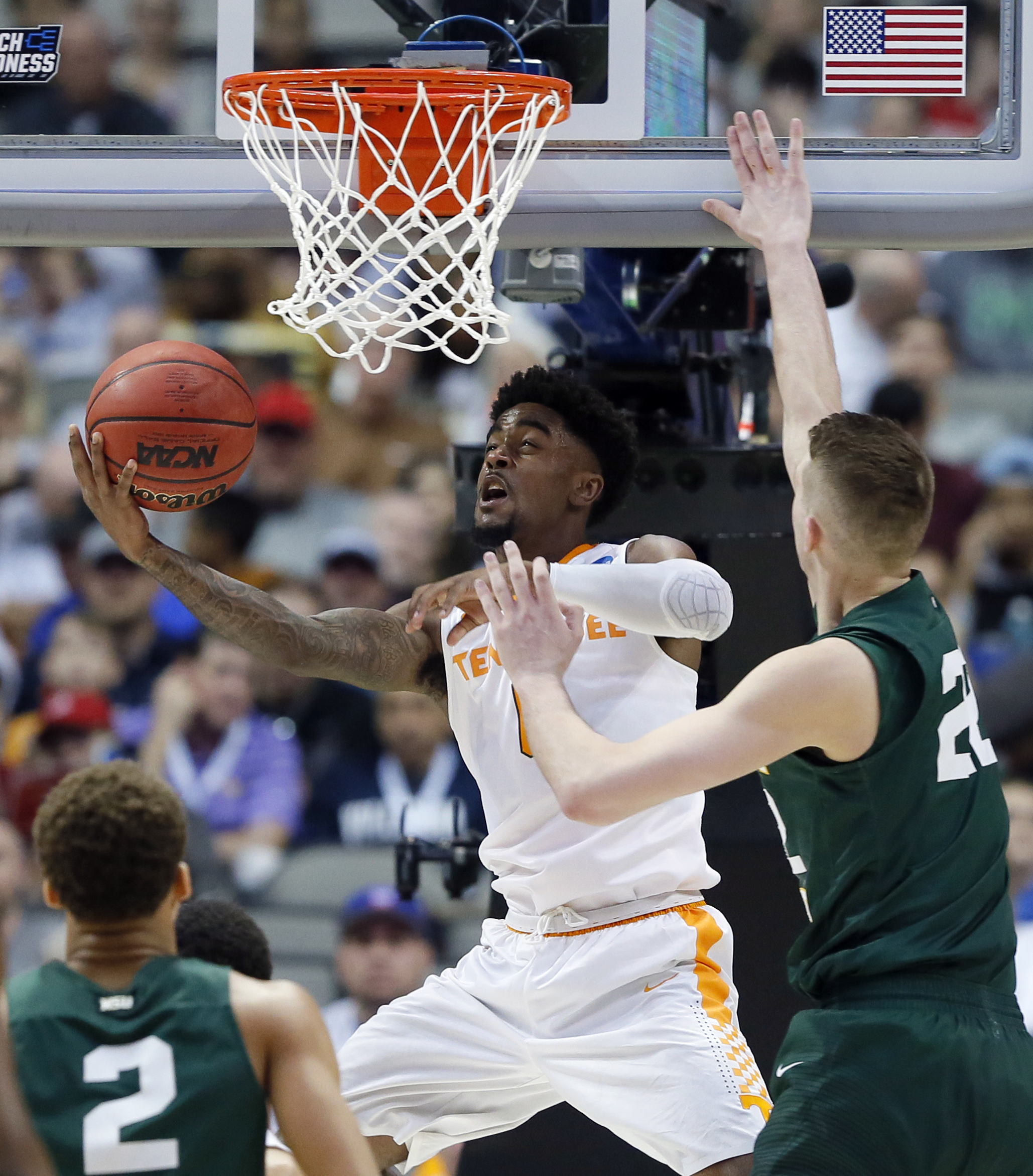 Wright State's Everett Winchester (2) and Parker Ernsthausen (22) defend as Tennessee guard Jordan Bone (0) goes up for shot in the second half in the first round of the NCAA men's college basketball tournament in Dallas, Thursday, March 15, 2018. (AP Photo/Tony Gutierrez)