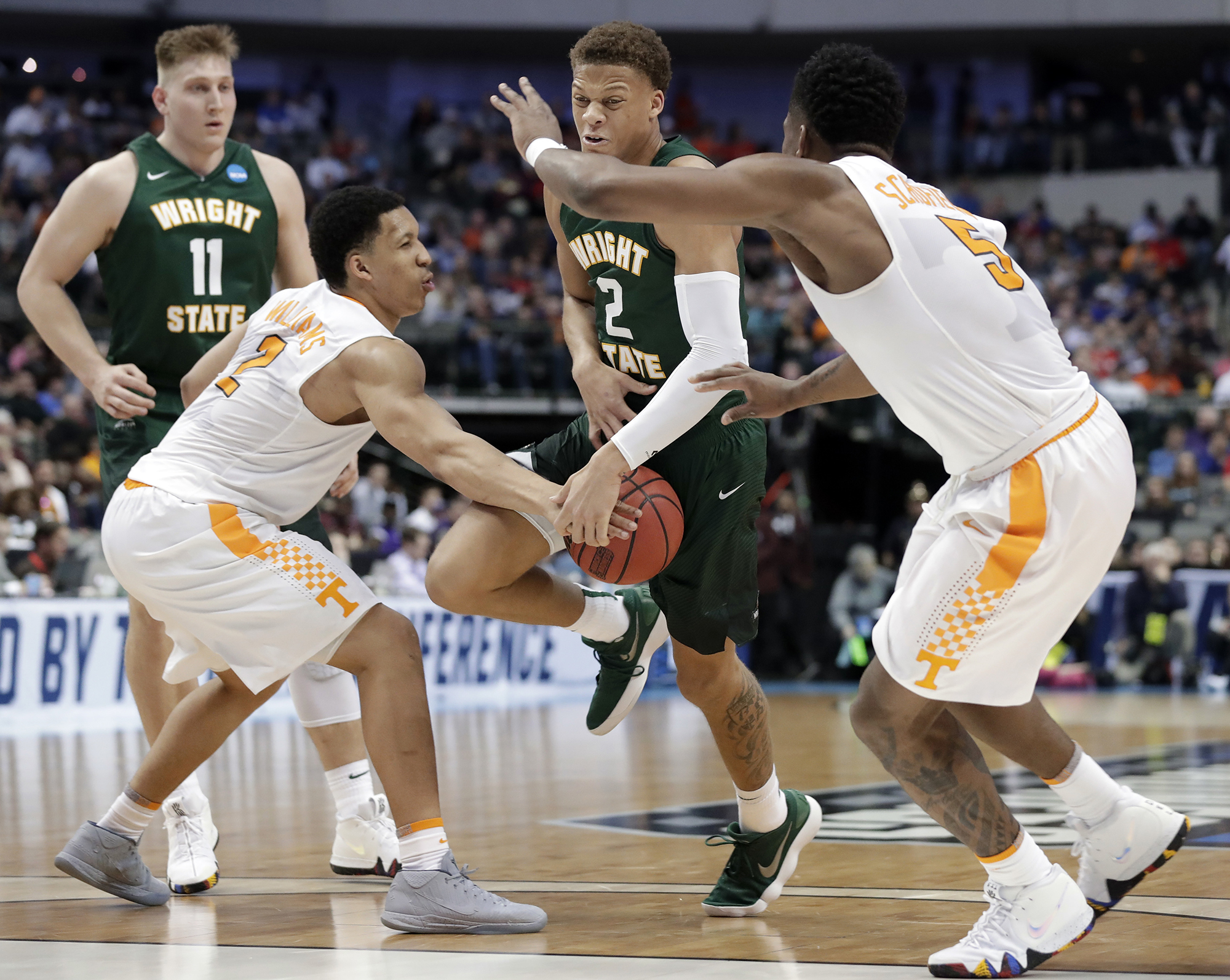 Tennessee forwards Grant Williams (2) and Admiral Schofield (5) combine to strip the ball away from Wright State forward Everett Winchester (2) in the second half of a first-round game at the NCAA college basketball tournament in Dallas, Thursday, March 15, 2018. (AP Photo/Tony Gutierrez)