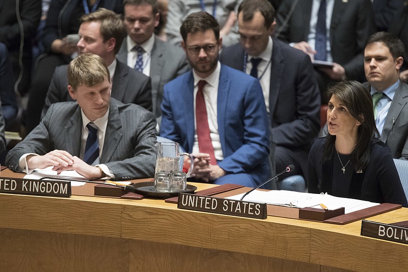 British Deputy Ambassador to the United Nations Jonathan Allen, right, listens as American Ambassador to the United Nations Nikki Haley speaks during a Security Council meeting on the situation between Britain and Russia, Wednesday, March 14, 2018 at United Nations headquarters. Britain said Wednesday it would expel 23 Russian diplomats and sever high-level bilateral contacts after Russia ignored a deadline to explain how a Soviet-developed nerve agent was used against ex-spy Sergei Skripal and his daughter Yulia. (AP Photo/Mary Altaffer)